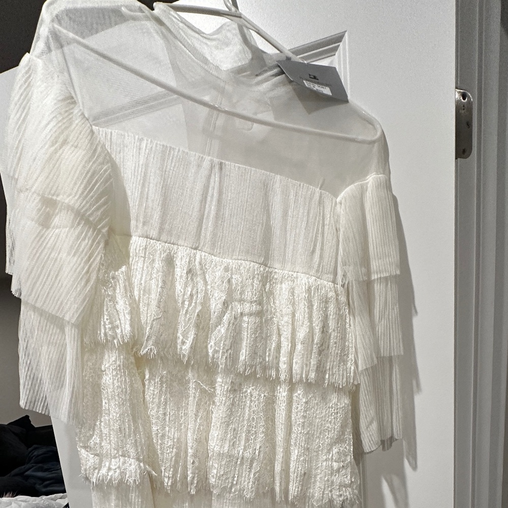 White dress fringe